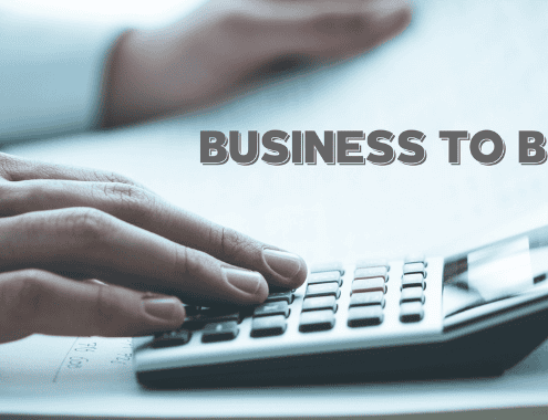 Calcolo budget marketing B2B: rappresentato da una calcolatrice e dei grafici.